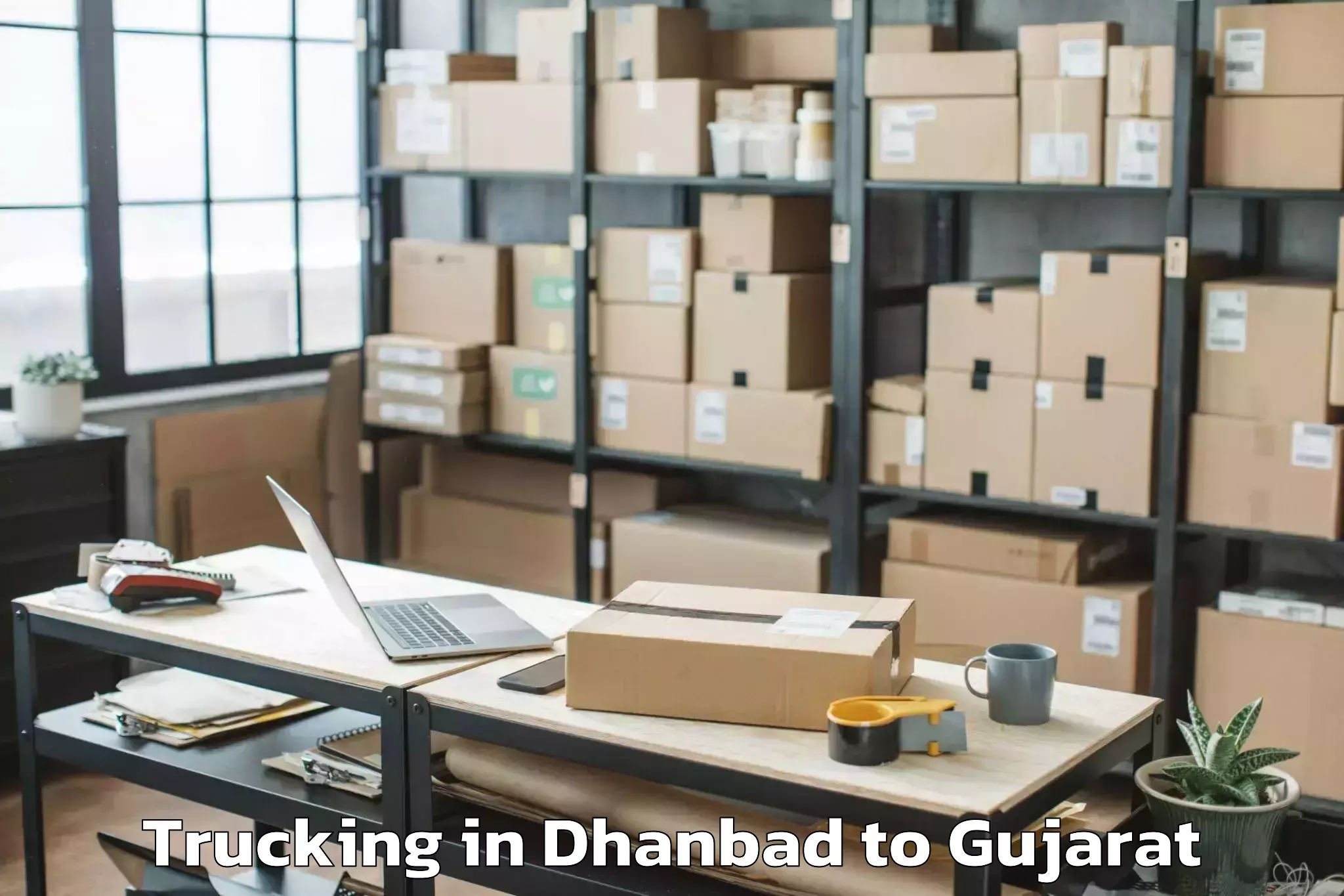 Affordable Dhanbad to Gujarat Ayurved University Jam Trucking